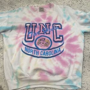 First of A kind UNC sweatshirt fits like a small/medium